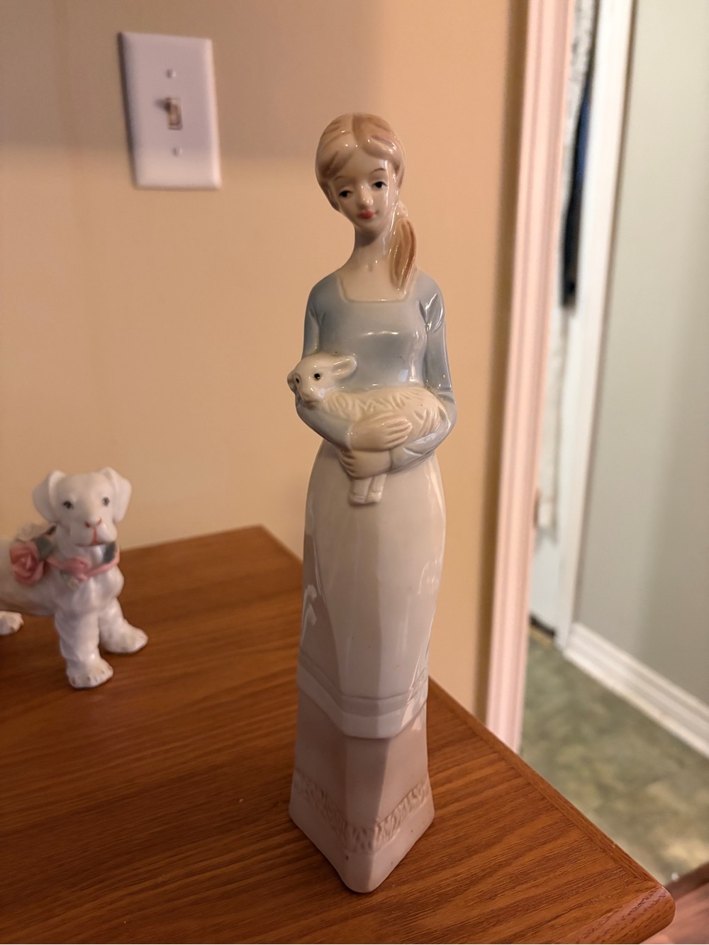 Blue and Cream Porcelain Figurine of Woman Holding Lamb